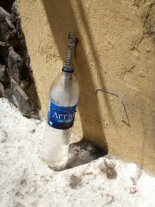 An air-conditioner outflow pipe leading to a bottle instead of dripping on the ground. Photo Credit: Daquella manera via Compfight cc